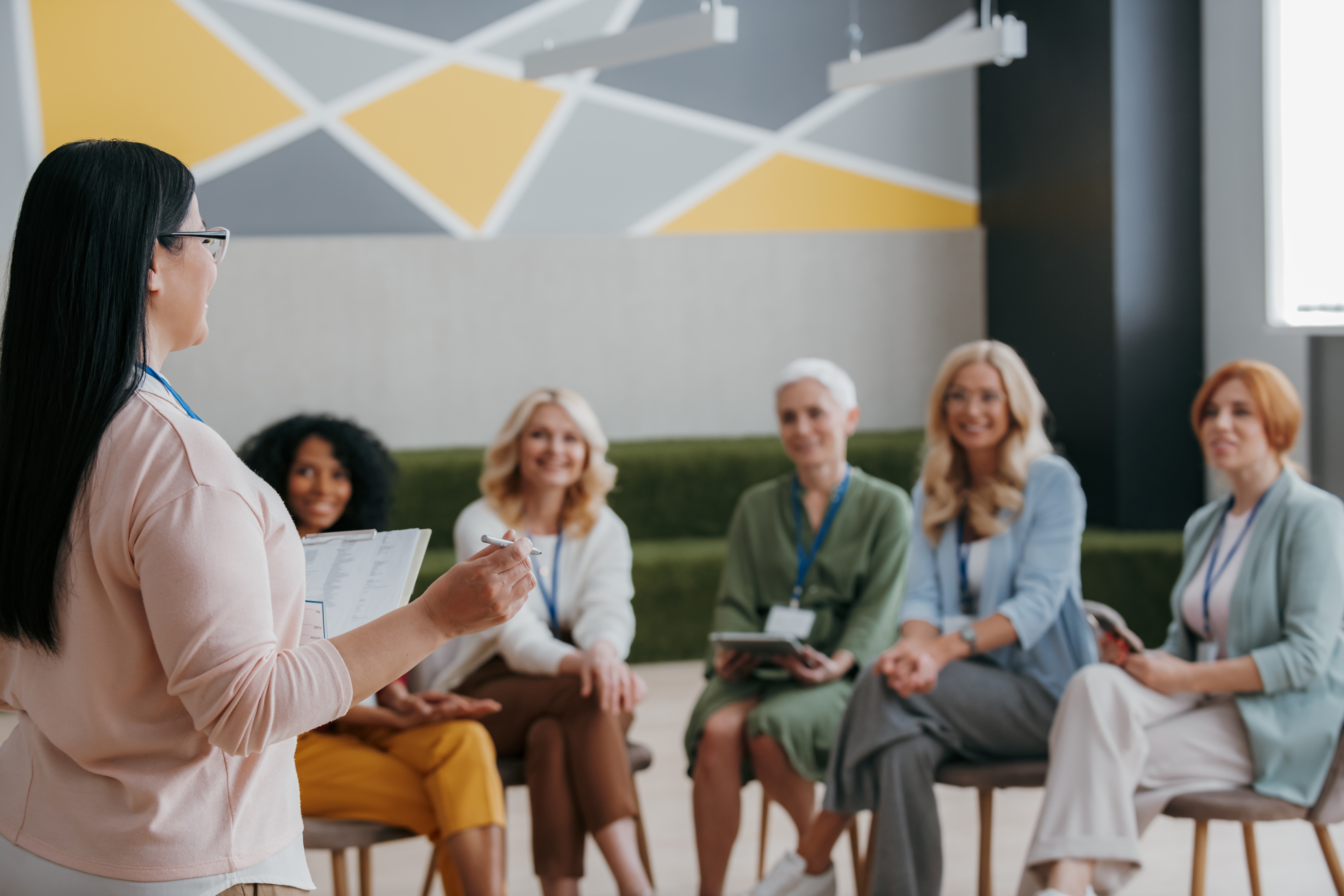 group of women listening to speaker